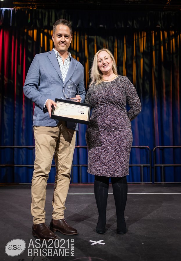 Tristan receiving the 2021 Awards of Excellence at the ASA conference in Brisbane.